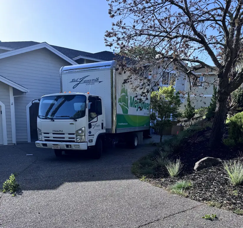 Farnsworth Express box truck in Mayflower livery parked in a Marin driveway